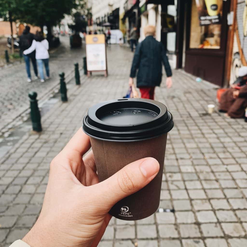 Holding a coffee