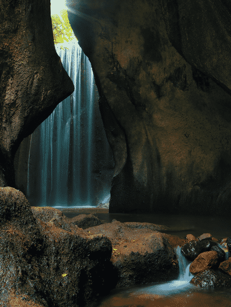 A waterfall in a cave

Description automatically generated with medium confidence