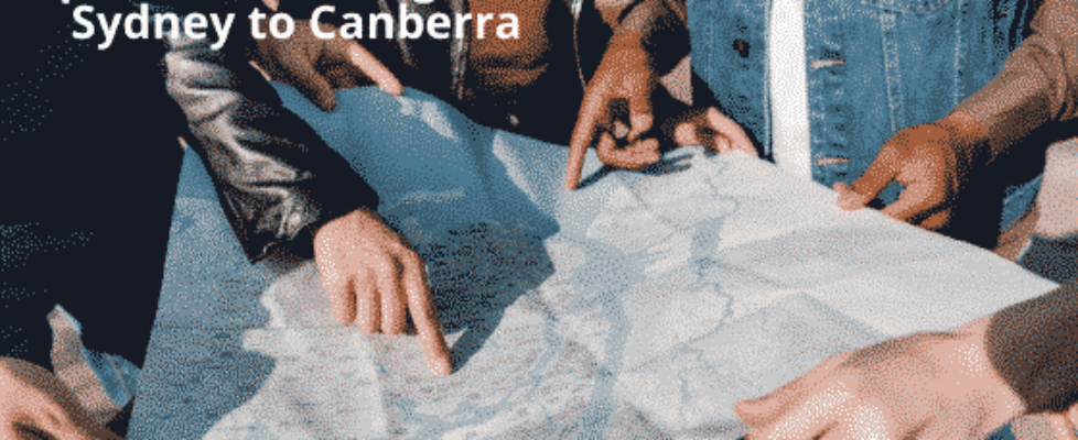 group of people pointing to a map