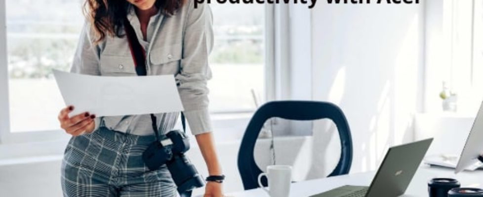 woman standing at desk looking at paper